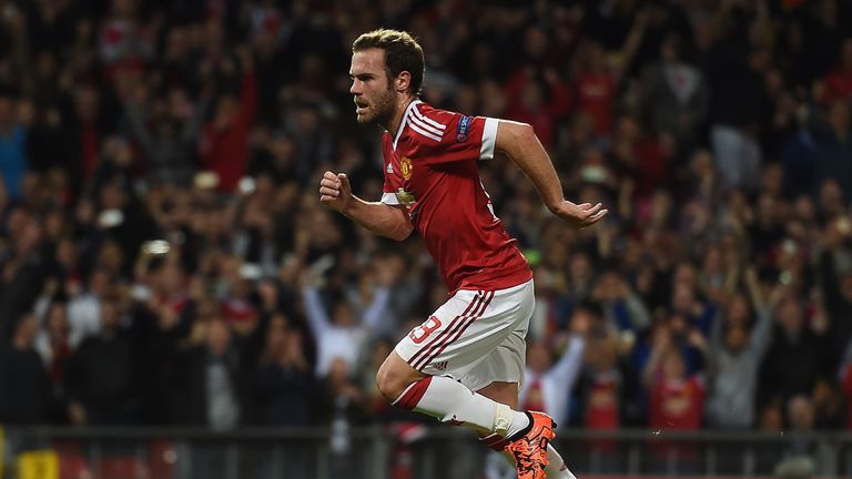 Man Utd's Juan Mata runs to get the ball after scoring from the penalty spot during the Champions League match against Wolfsburg at Old Trafford