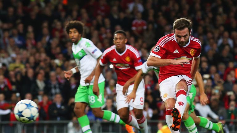 Juan Mata equalises from the penalty spot during the Champions League match between Manchester United and Wolfsburg 
