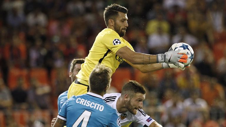 Zenit goalkeeper Juri Lodygin gathers the ball