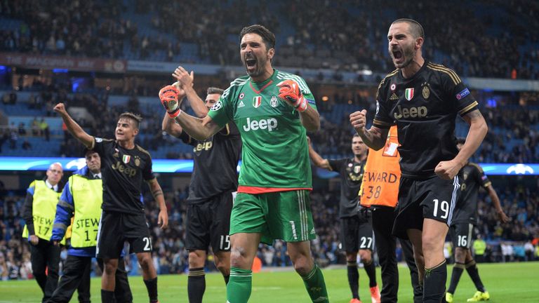 Juventus' goalkeeper Gianluigi Buffon (C) and Juventus' defender Leonardo Bonucci (R) celebrate
