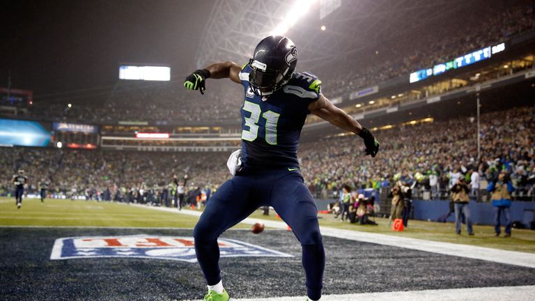 Kam Chancellor #31 of the Seattle Seahawks celebrates after scoring a 90 yard touchdown off of an interception in the fourth qua