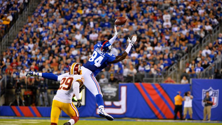 EAST RUTHERFORD, NJ - SEPTEMBER 24:   Larry Donnell #84 of the New York Giants attempts to complete a pass against  Chris Culliver #29 of the Washington Re