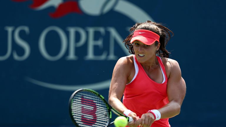Laura Robson of Great Britain returns a shot to Elena Vesnina of Russia during their Women's Singles First Round match on Day