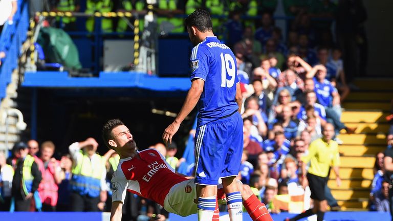 Diego Costa of Chelsea and Laurent Koscielny of Arsenal clash