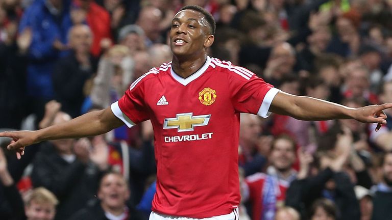 Anthony Martial of Manchester United celebrates scoring their third goal 