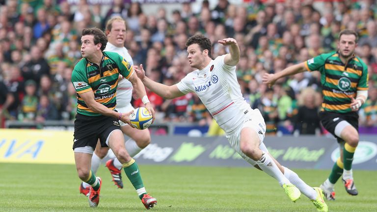 Northampton's Lee Dickson passes before being tackled by Saracen's Duncan Taylor during the play-off semi-final in May