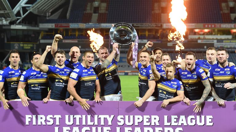 Leeds Rhinos' Jamie Peacock (centre left) and Kevin Sinfield (centre right) lift the League Leaders' Shield after victory at Huddersfield