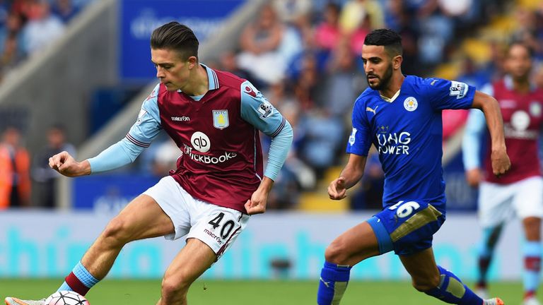 Jack Grealish  is closed down by Riyad Mahrez