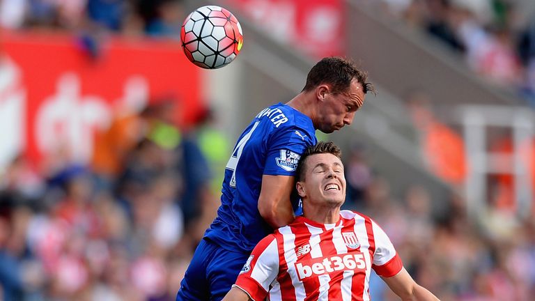 STOKE ON TRENT, ENGLAND - SEPTEMBER 19: Danny Drinkwater of Leicester City and Marco van Ginkel of Stoke City compete for the ball during the Barclays Prem