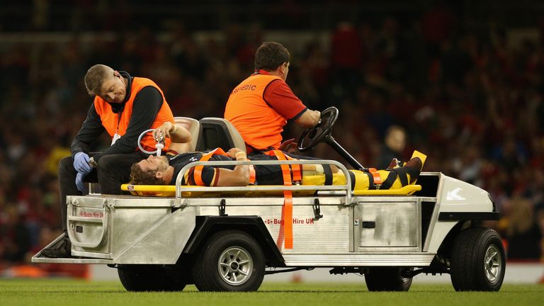 Wales full-back Leigh Halfpenny receives oxygen as he is stretchered off  at the Millennium Stadium