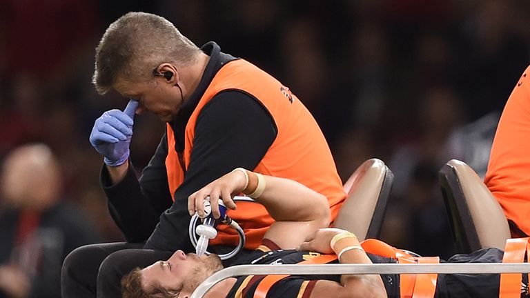 Wales' Leigh Halfpenny leaves the field on a stretcher during the World Cup warm-up match v Italy