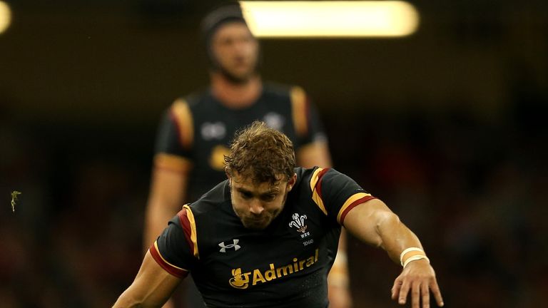 Leigh Halfpenny of Wales kicks a penalty against Italy before being stretchered off at Cardiff