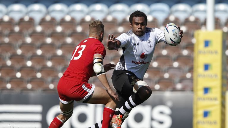 Fiji's lock Leone Nakarawa (R) vies with Canada's centre Conor Trainor