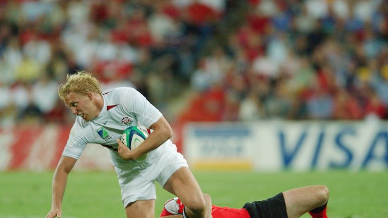 BRISBANE, AUSTRALIA - NOVEMBER 8:  Lewis Moody of England is tackled by Stephen Jones of Wales during the Rugby World Cup Quarter Final match between Engla