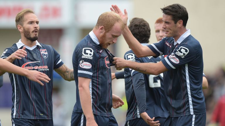 Liam Boyce (centre) is congratulated by team mate Brian Graham after opening the scoring for Ross County