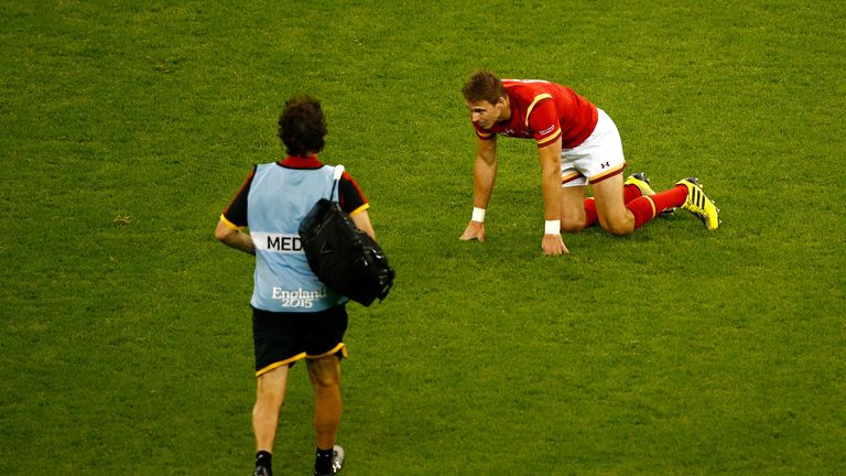 Liam Williams of Wales goes down with an injury against Uruguay