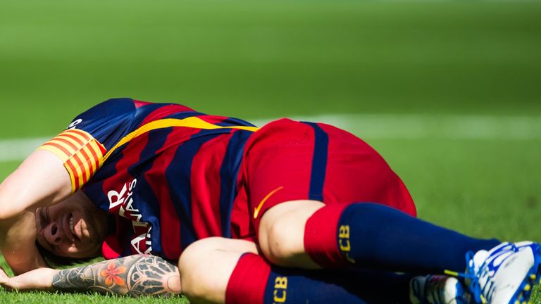 Lionel Messi lies injured against Las Palmas