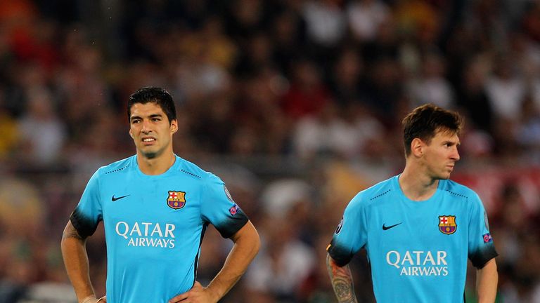  Luis Suarez and Lionel Messi of FC Barcelona look on during the UEFA Champions League Group E match between AS Roma and FC Barcelona