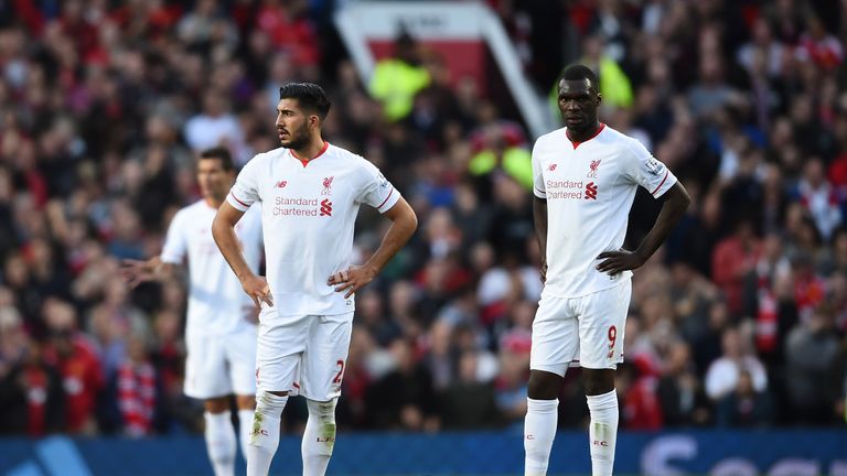 Emre Can and Christian Benteke of Liverpool look dejected during the Barclays Premier League match between Manchester United