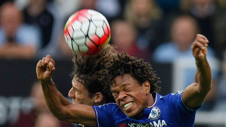 Loic Remy of Chelsea and Fabricio Coloccini of Newcastle United compete for the ball during the Barclays Premier League match at St James' Park