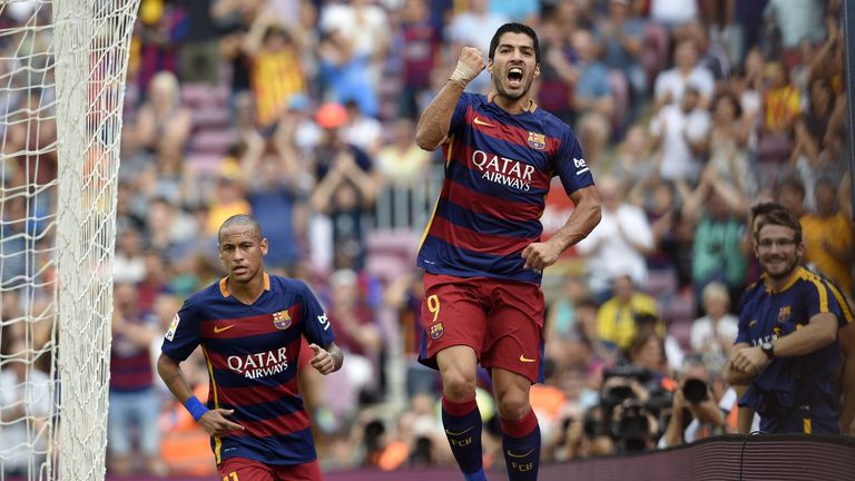 Luis Suarez (R) celebrates a goal next to Barcelona's Brazilian forward Neymar (L) during the Spanish league football match v UD Las Palmas at Camp Nou