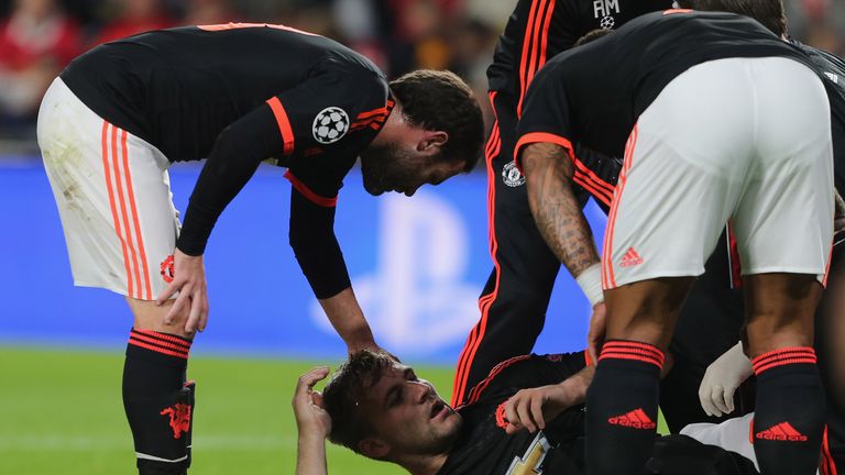 Luke Shaw of Manchester United receives treatment