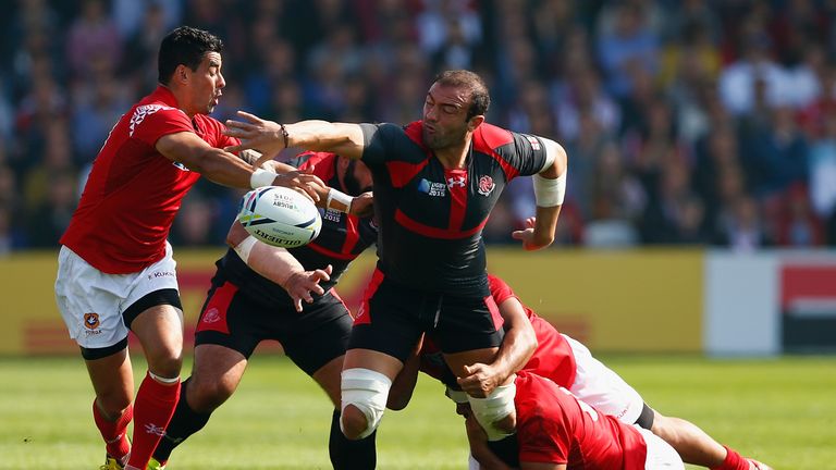 Georgia captain Mamuka Gorgodze is tackled by the Tonga defence during the 2015 Rugby World Cup