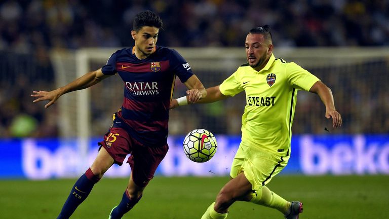 XXXXX (L) vies with XXXXX during the Spanish league football match FC Barcelona vs Levante UD at the Camp Nou stadium in Barcelona on September 20, 2015.