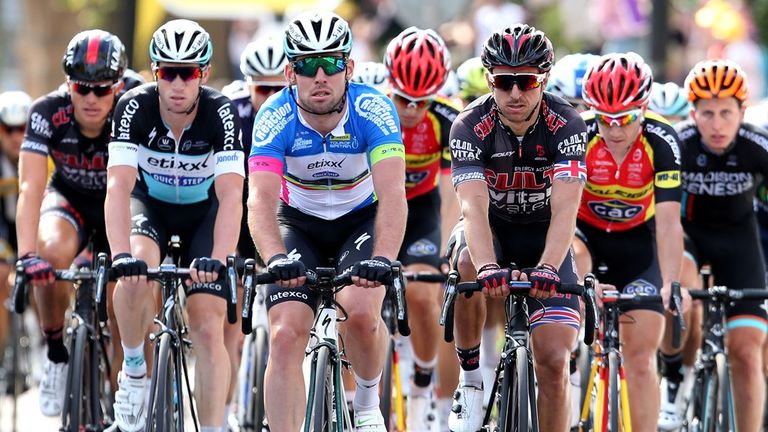 Mark Cavendish (centre) and the trailing pack cross the finish line in Colne town centre, during Stage Two of the Tour of Britain 