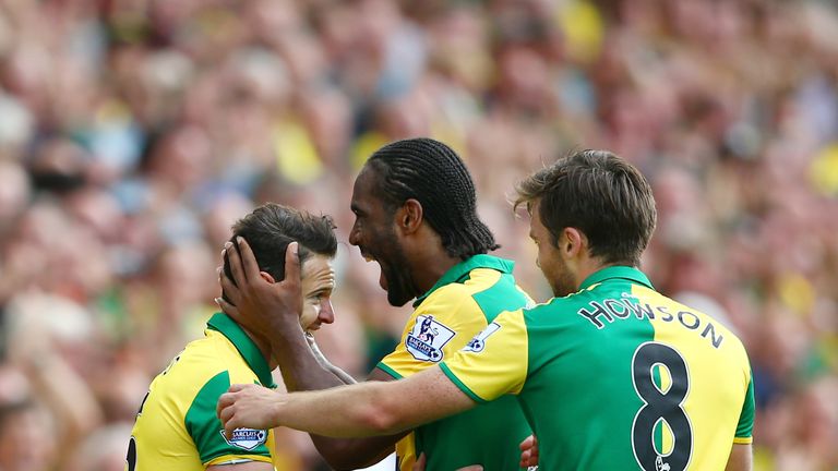 Matthew Jarvis (L) of Norwich City celebrates scoring his team's third goal with team mates during the Barclays Premier League match Bournemouth