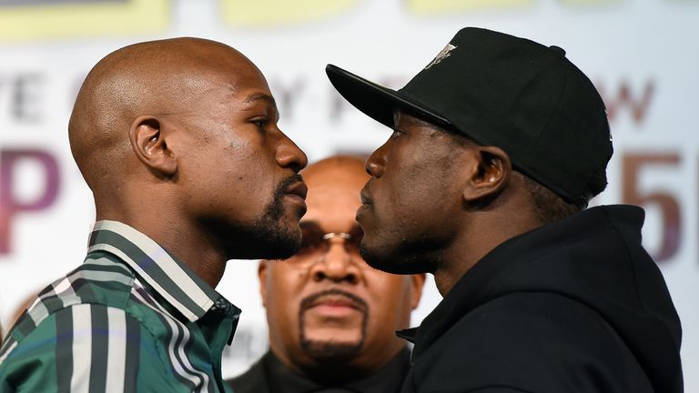 Mayweather Jr. (L) and Andre Berto face off during a news conference at MGM Grand Hotel & Casino on September 9