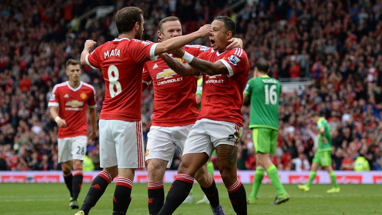 Manchester United's Dutch midfielder Memphis Depay celebrates scoring their opener