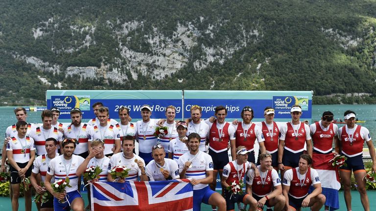 Great Britain's rowers celebrate on the podium after they won the men's coxed eight 