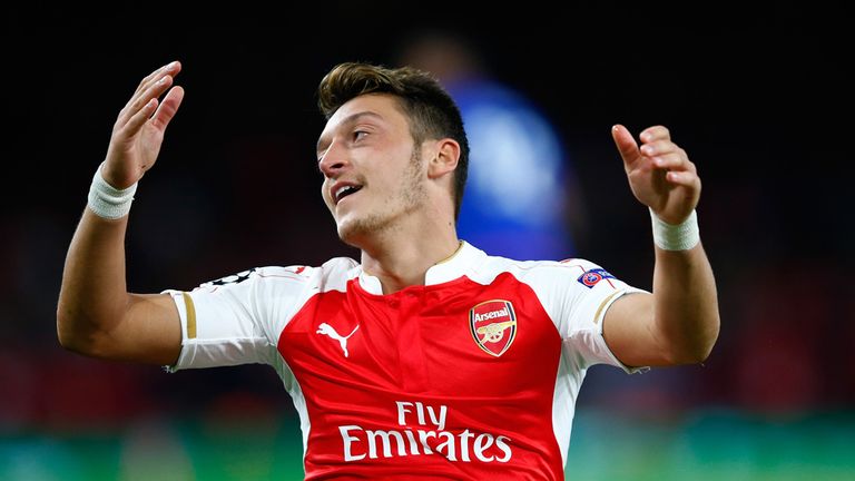 LONDON, ENGLAND - SEPTEMBER 29:  Mesut Oezil of Arsenal reacts during the UEFA Champions League Group F match between Arsenal FC and Olympiacos FC at the E