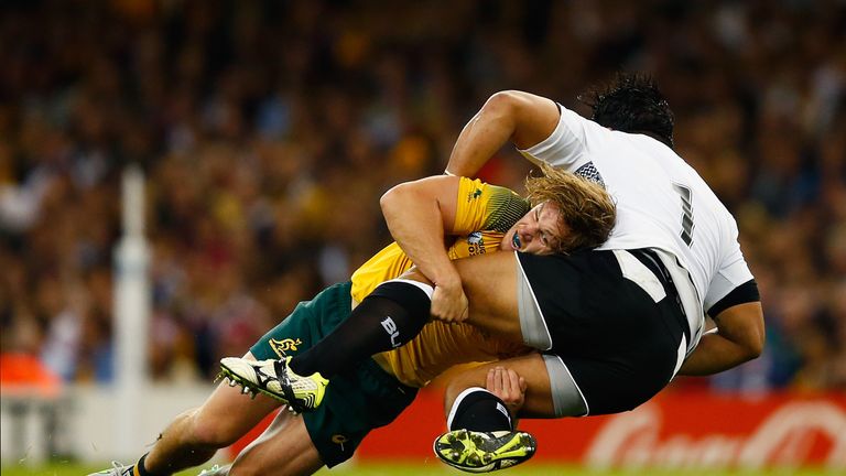 Michael Hooper tackles Campese Ma'afu of Fiji 