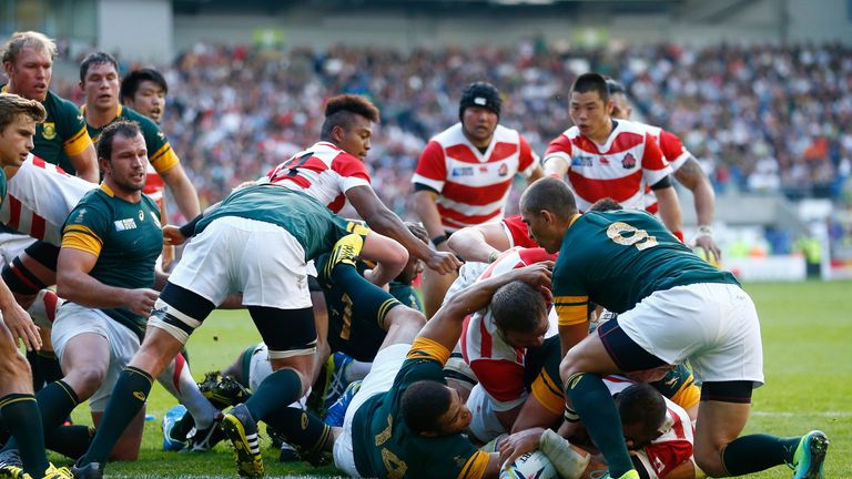 Michael Leitch of Japan scores a try against South Africa 