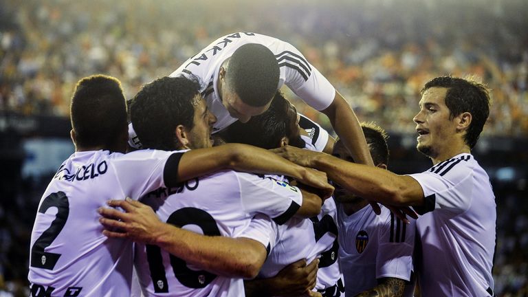 Valencia players celebrate Shkodran Mustafi's goal during the Spanish league football match v Granada CF at the Mestalla stadium