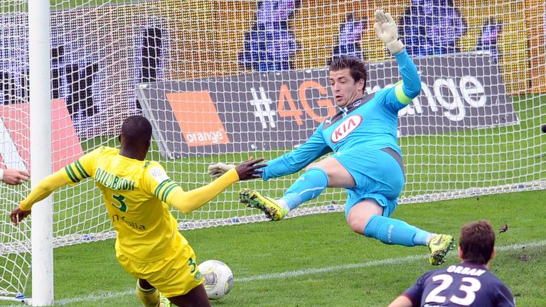 Nantes' defender Papy Djilobodji (L) scores a goal during the French L1 football match Bordeaux (FCGB) vs Nantes on November 10, 2013 at Chaban Delmas Stad