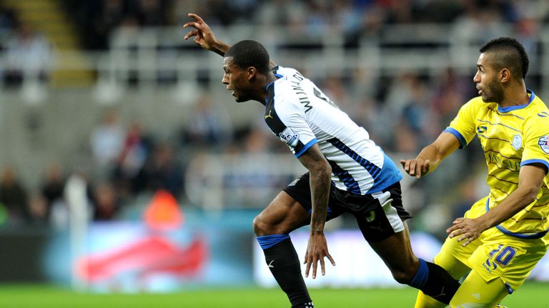 Newcastle United's Georginio Wijnaldum and Sheffield Wednesday's Lewis McGugan during the Capital One Cup, third round match at St James' Park, Newcastle.