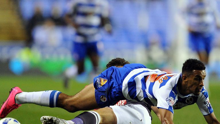 Reading's Nick Blackman (top) and Derby County's Jacob Butterfield battle for the ball