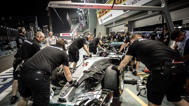Nico Rosberg is pushed back into the garage 
