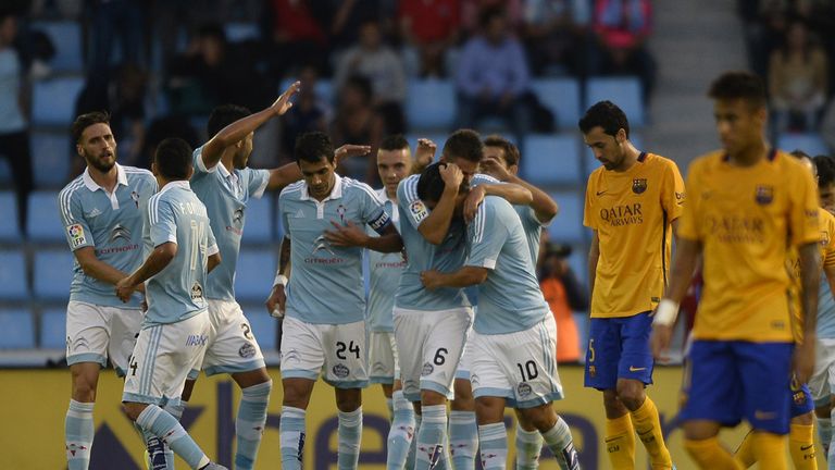 Celta Vigo's forward Nolito (C) celebrates with teammates after scoring a goal