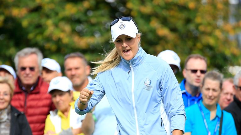 Anna Nordqvist of the European Team holes a birdie putt on the 8th green in her match with Caroline Hedwall 
