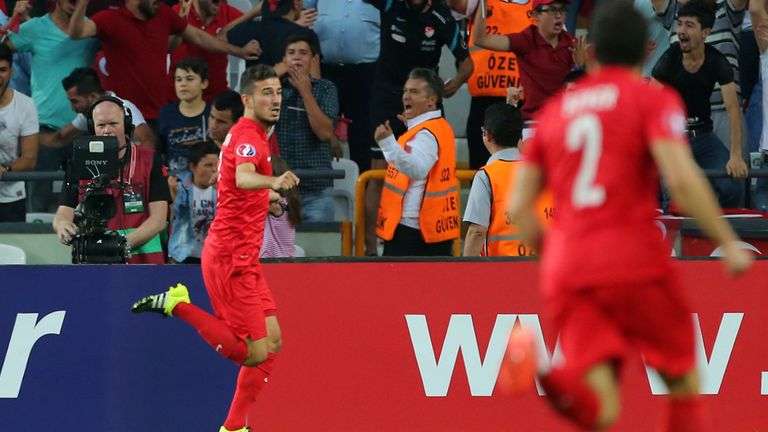 Turkey's midfielder Oguzhan Ozyakup (C) celebrates after scoring a goal against Netherlands