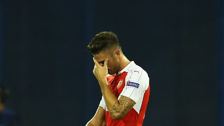 Olivier Giroud of Arsenal walks off after being shown the red card against Dinamo Zagreb
