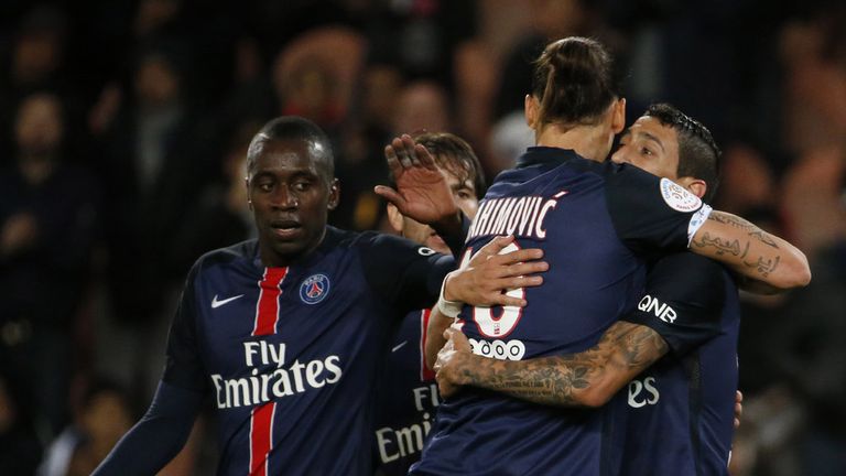 Paris Saint-Germain's Swedish forward Zlatan Ibrahimovic (2ndR) is congratulated by teammates 