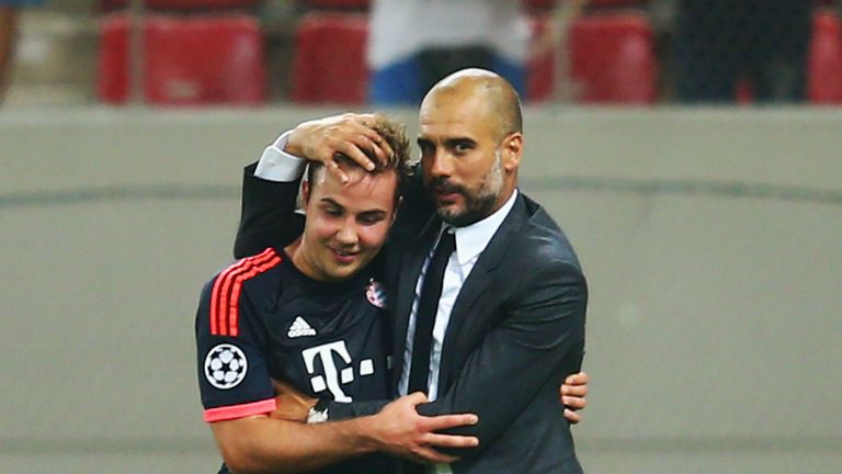 Head coach Pep Guardiola of Bayern Munich hugs Mario Goetze