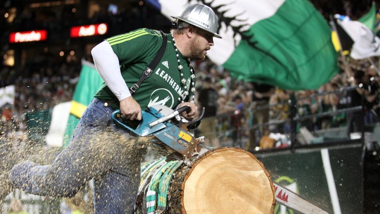PORTLAND, OR - SEPTEMBER 16: Timber Joey, mascot of the Portland Timbers cuts a slab of wood against the New England Revolution  on September 16, 2011 at J