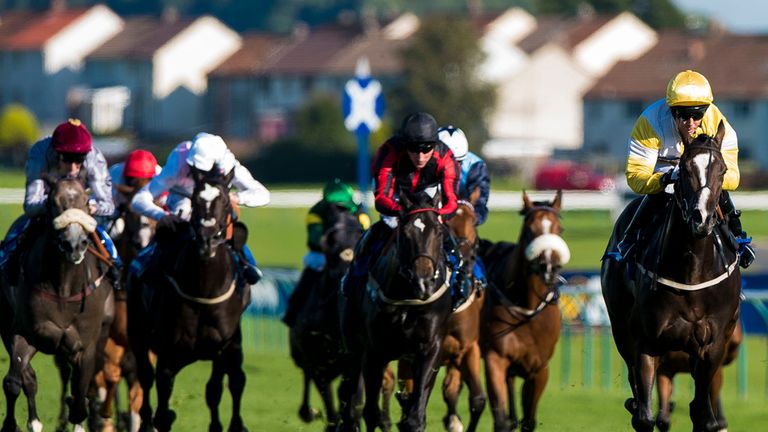 Quiet Reflection (right) comes home in front under Graham Lee to win the Rosebery