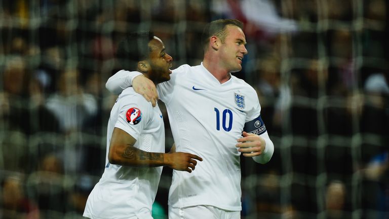 Goalscorer Raheem Sterling of England (L) and Wayne Rooney of England celebrate the third goal against  Lithuania